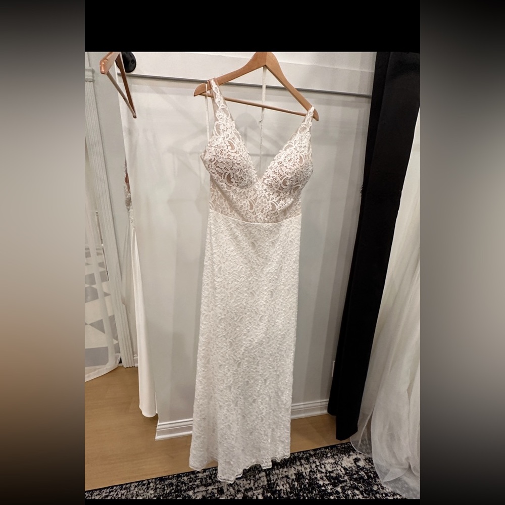Never been worn or altered dress! Mikaella Bridal dress winter 2023.
Size 14